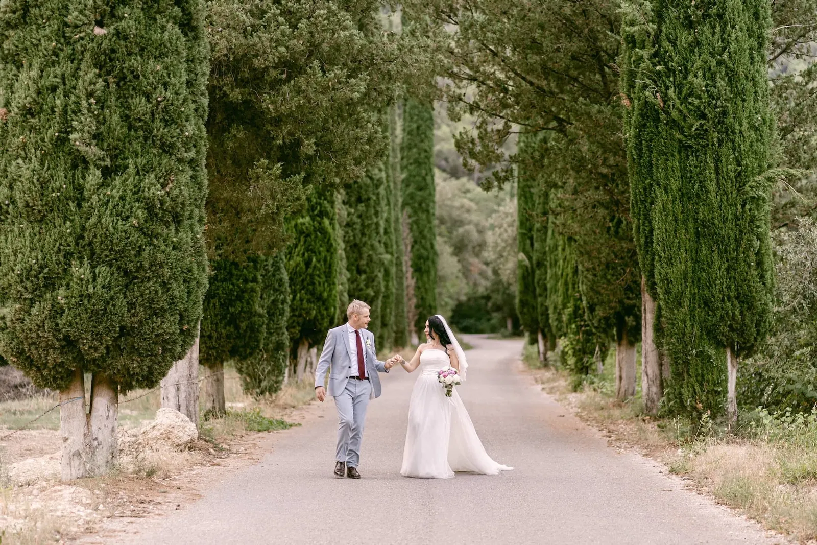 Romantic couple cypress lined path abbazia san pietro valle